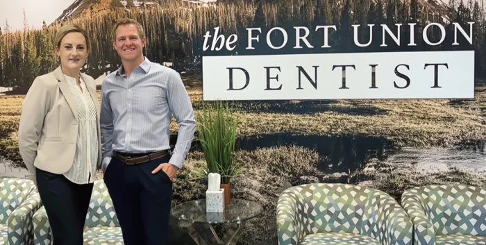 Dr. Sego and Dr. Hyams pose for a photo in front of The Fort Union Dentist in Midvale, UT